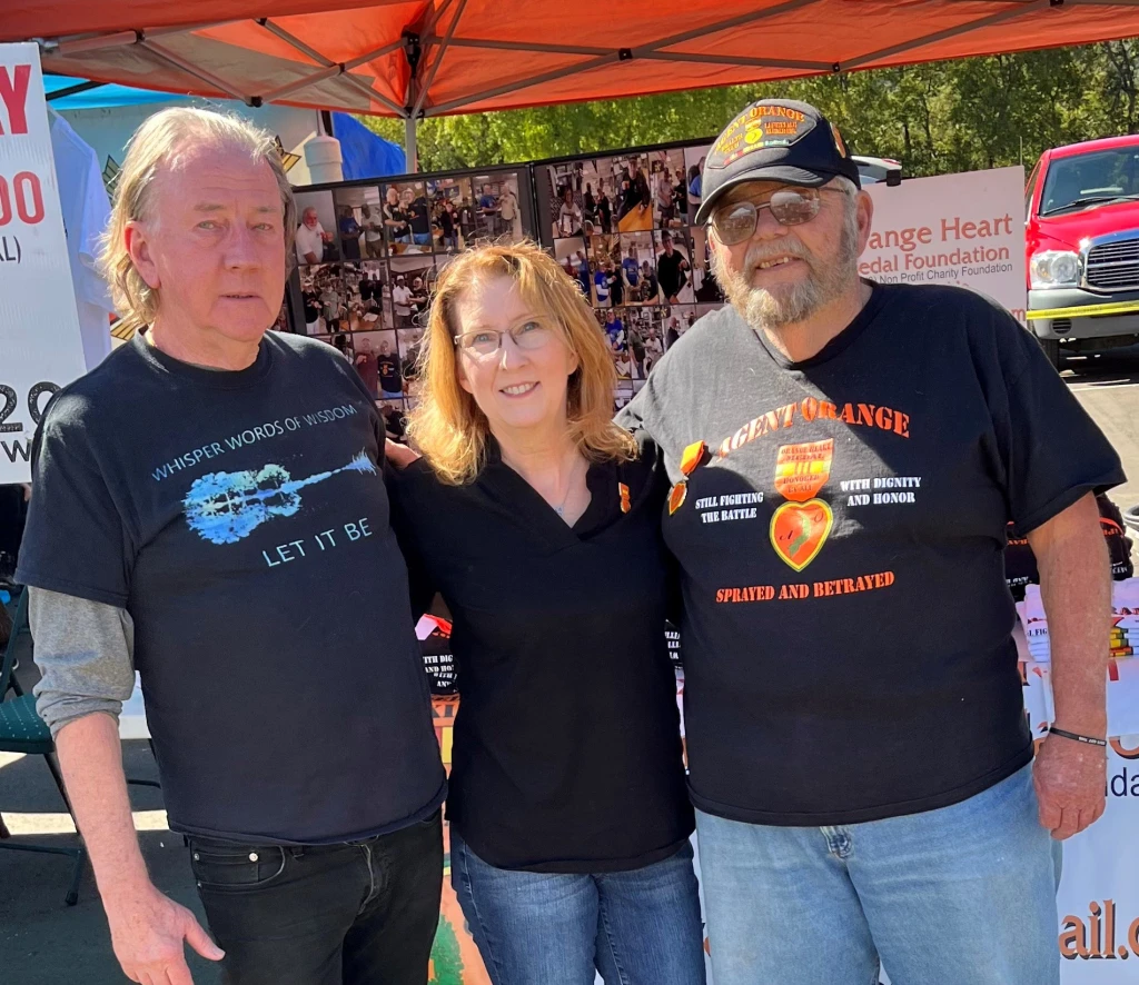Kaylon Bruner-Tran, PhD (center) with her long-time research partner, Kevin Osteen, PhD (left)
										and Ken Gamble (right), the founder of the Orange Heart Medal Foundation which recognizes American
										Vietnam-Era veterans exposed to Agent Orange.